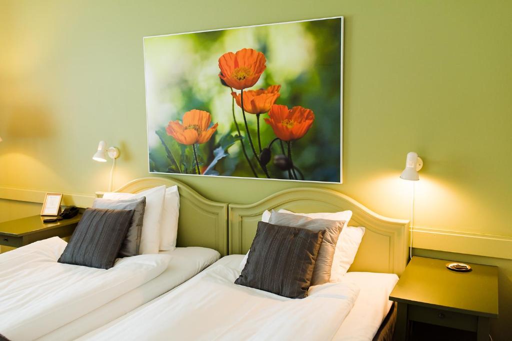 Postel nebo postele na pokoji v ubytování Mauritzbergs Slott & Golf