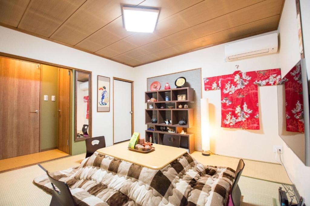 a room with a bed and a table in it at Chikuan Kyoto Whole Rental Lodging - Vacation STAY 78789v in Kyoto