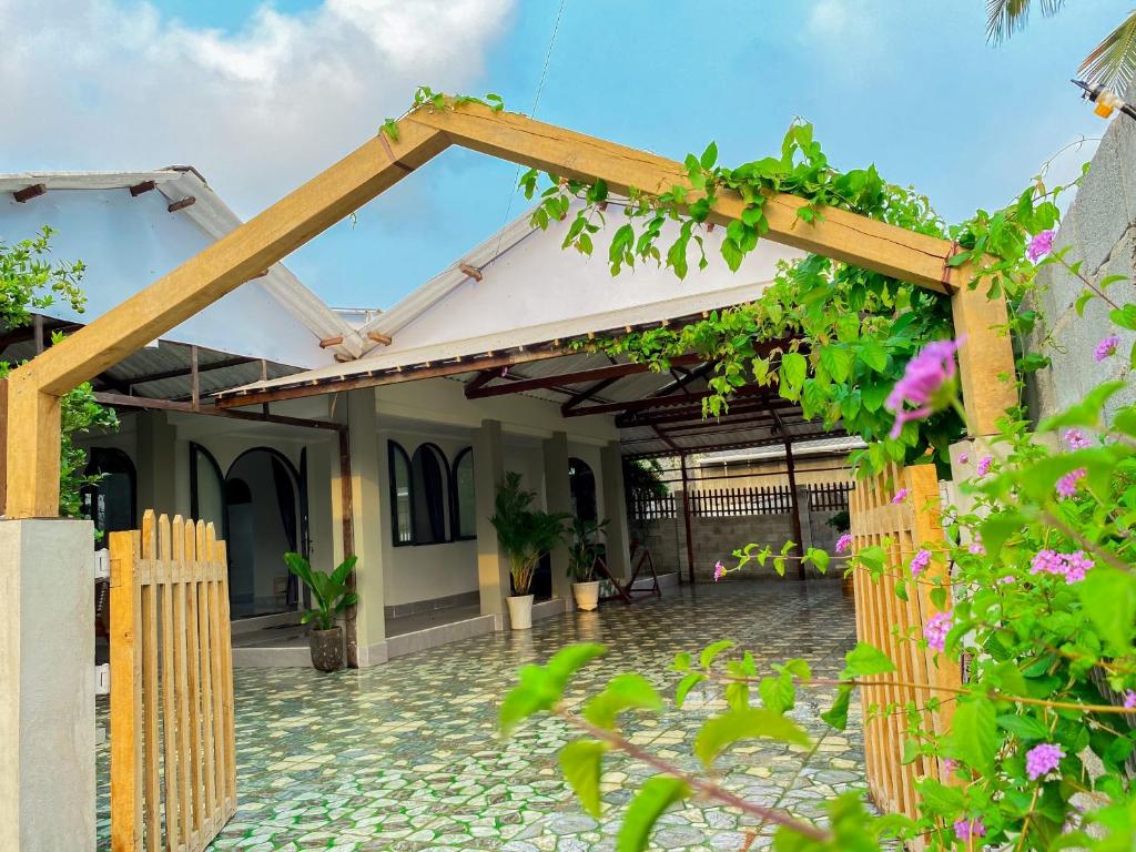 a patio of a house with a wooden pergola at Le Villa Ke Ga Lighthouse in Ke Ga