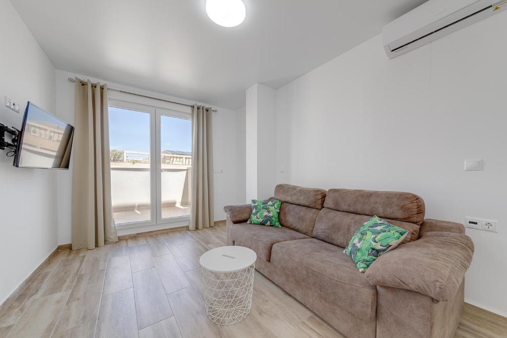 Zona de estar de Apartments CURA BEACH
