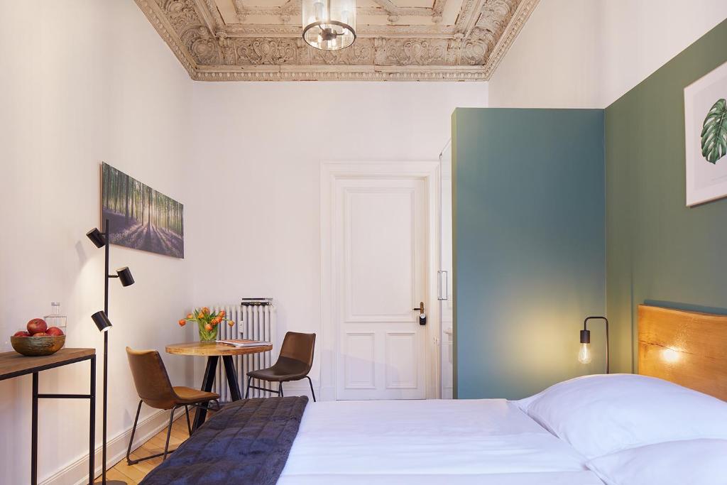 Postel nebo postele na pokoji v ubytování Hotel am Museum