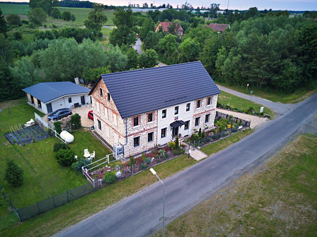 an aerial view of a large house on a road at Dom Mili in Henryków Lubański