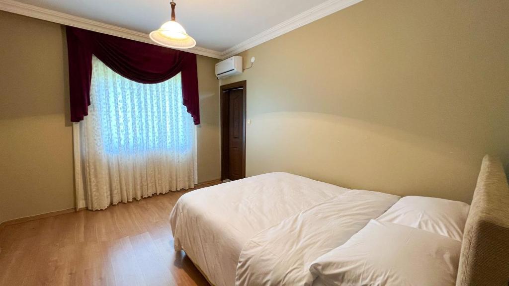 Postel nebo postele na pokoji v ubytování Heaven Twın Villa