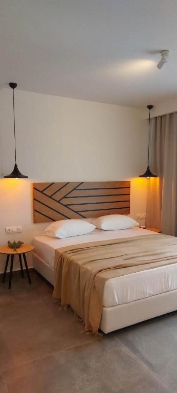 Postel nebo postele na pokoji v ubytování Delight Suites