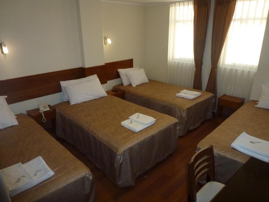 Postel nebo postele na pokoji v ubytování Hostal Qoyllurwasi