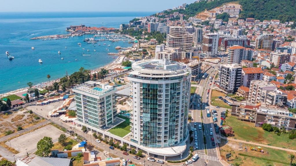 an aerial view of a city and the ocean at TC BiG APARTMENTS in Budva