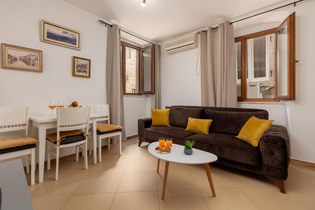 a living room with a couch and a table at Apartment Amigo 2 Old Town Kotor in Kotor