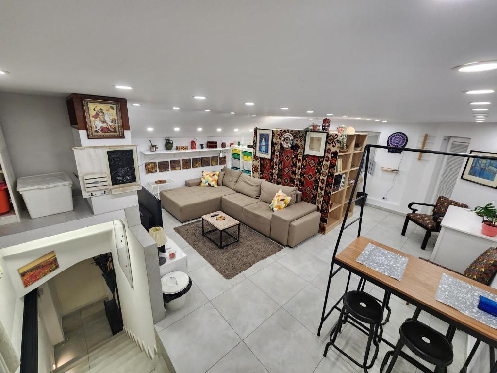 a living room with a couch and a table at Professor's Krunska Studio in Belgrade