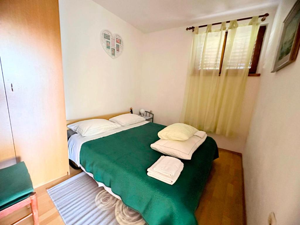 Postel nebo postele na pokoji v ubytování Apartmani Mediteran Copic