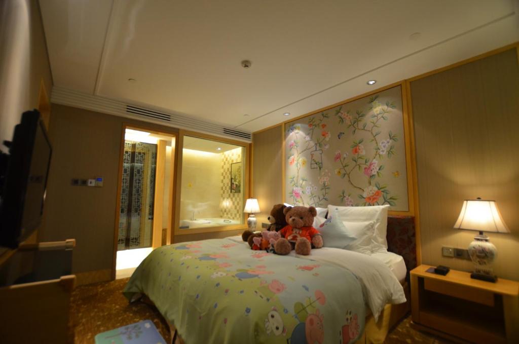 Postel nebo postele na pokoji v ubytování Panyu Hotel