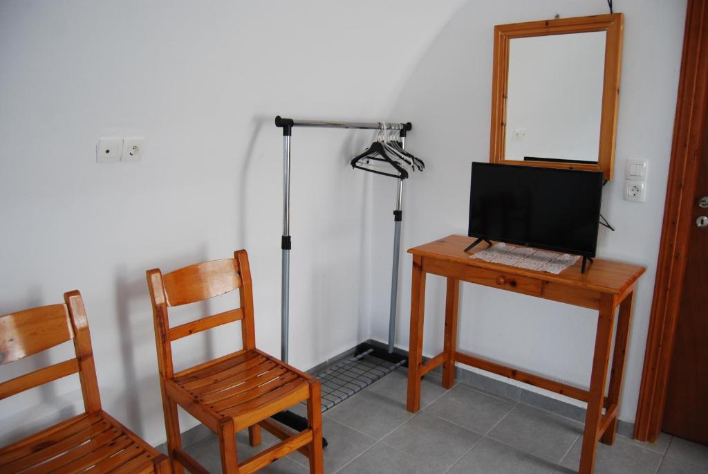 TV a/nebo společenská místnost v ubytování Apollo Rooms