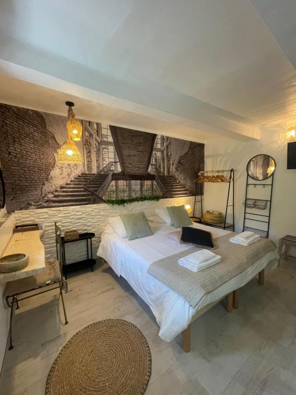 Postel nebo postele na pokoji v ubytování Hôtel Auberge Provençale