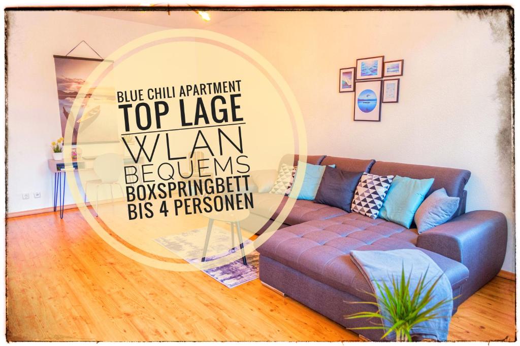 a living room with a couch and a mirror at Blue Chili 01 - TOP City Lage am HBhf Boxspringbett bis 4 Pers in Magdeburg