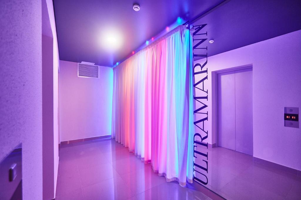 a hallway with a colorful curtain in a room at Ultramarinn Hotel in Odesa