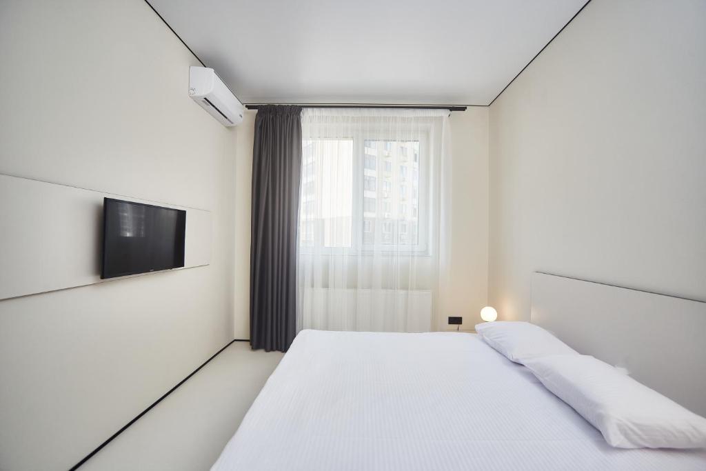 Postel nebo postele na pokoji v ubytování Ultramarinn Hotel