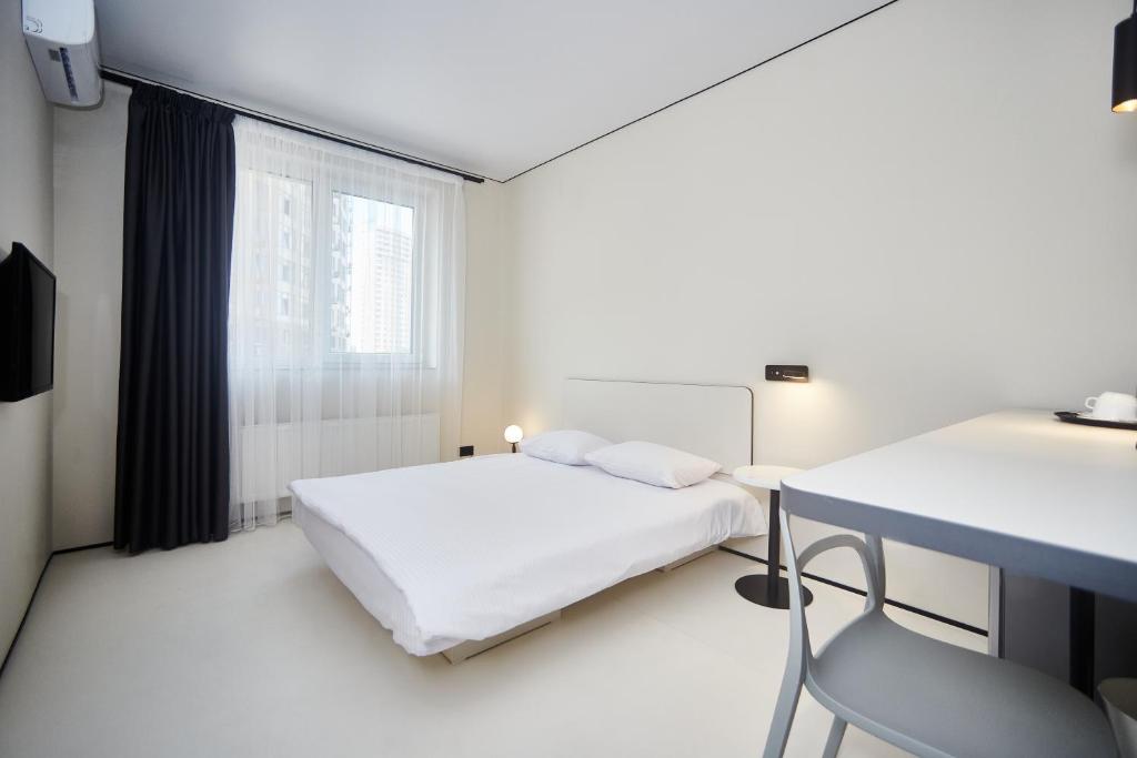 Postel nebo postele na pokoji v ubytování Ultramarinn Hotel