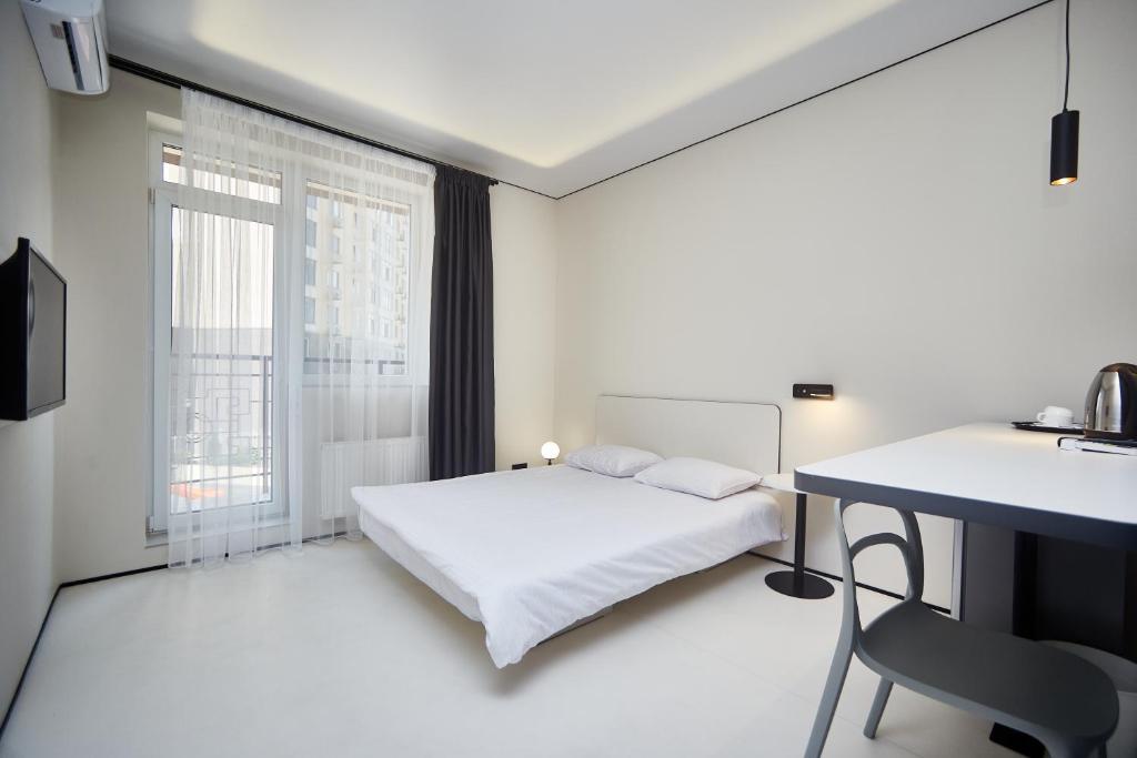 Postel nebo postele na pokoji v ubytování Ultramarinn Hotel