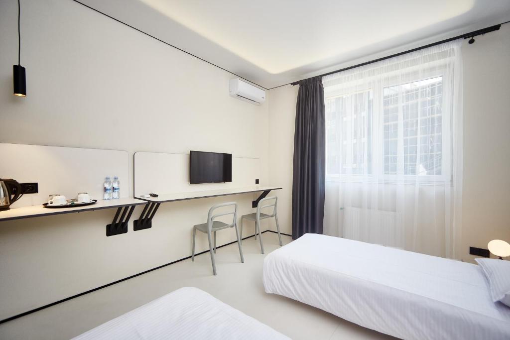 TV a/nebo společenská místnost v ubytování Ultramarinn Hotel