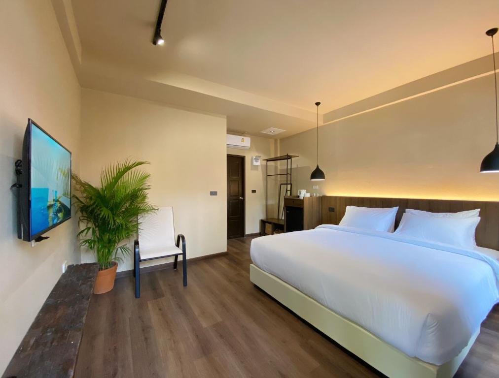 Postel nebo postele na pokoji v ubytování Suncloud Hotel Koh Samet