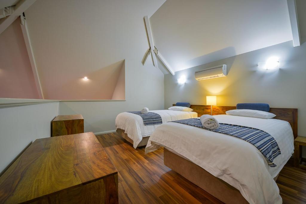 Postel nebo postele na pokoji v ubytování Exmouth Escape Resort