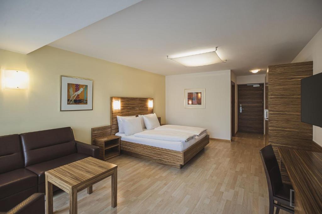 Postel nebo postele na pokoji v ubytování Hotel Brötz
