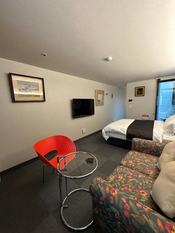 TV a/nebo společenská místnost v ubytování Hotel 草石庵