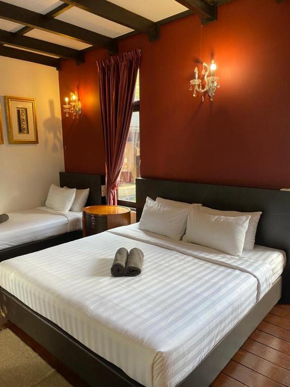 Postel nebo postele na pokoji v ubytování Cahaya Villa