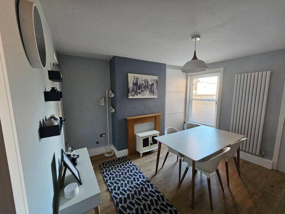 a dining room with a table and chairs in a room at Jubilee House in Newark-on-Trent