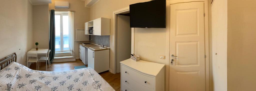 Postel nebo postele na pokoji v ubytování Affittacamere VIA ROMA 12
