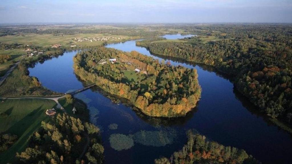 an aerial view of a river with trees and water at Obuoliu sala Moletu Vila in Gaylyunay