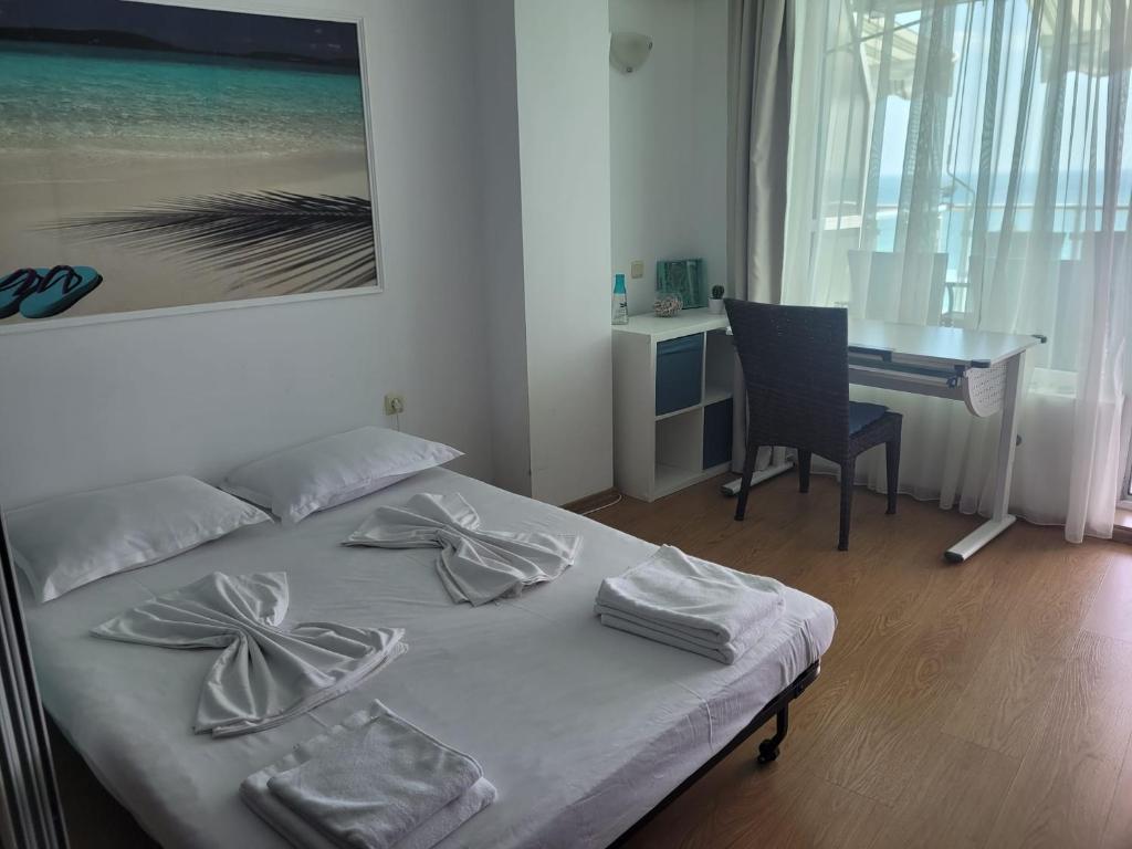 a bedroom with a bed with a desk and a desk at Silver A28 in Byala