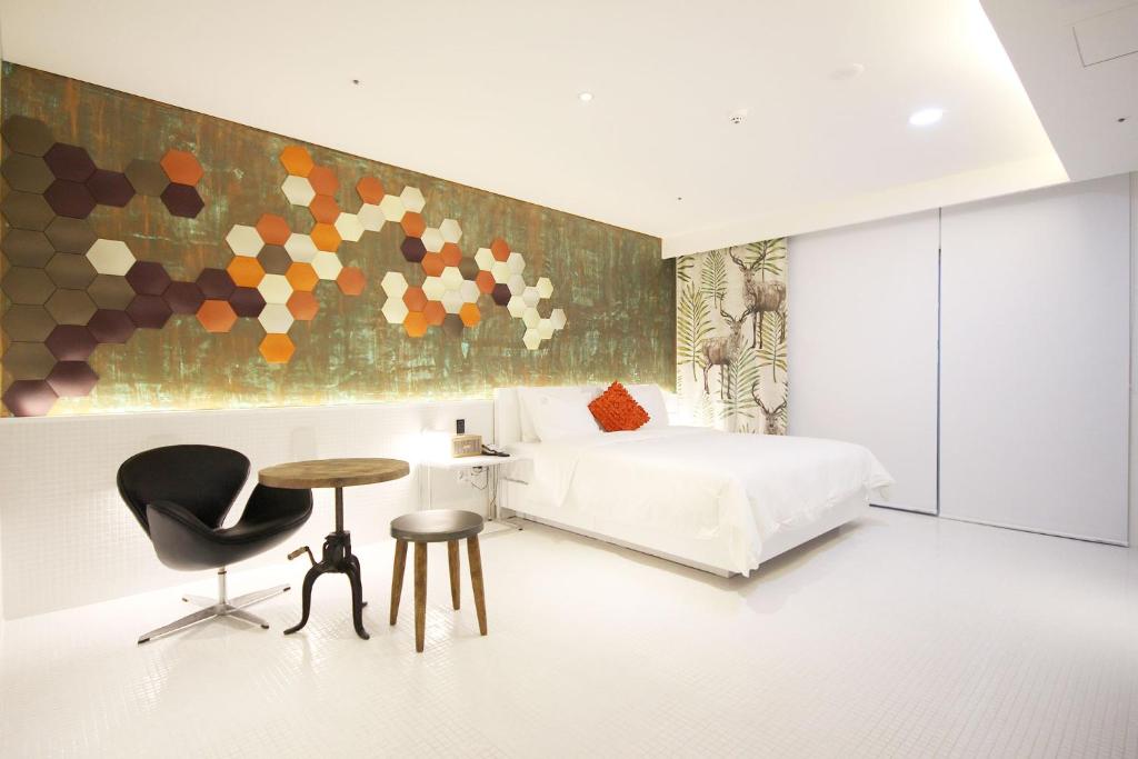 Postel nebo postele na pokoji v ubytování Ulsan Samsan Pandora Hotel