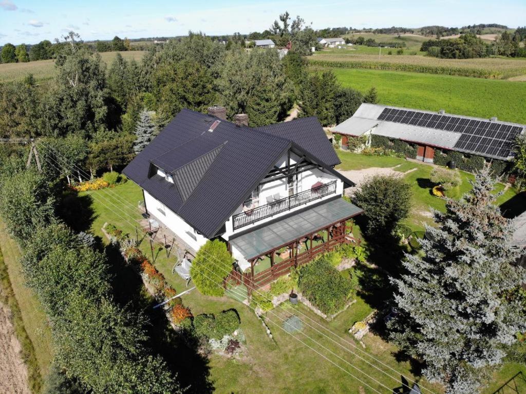 an overhead view of a house with solar panels at Pokoje. Apartament w Oklinach 