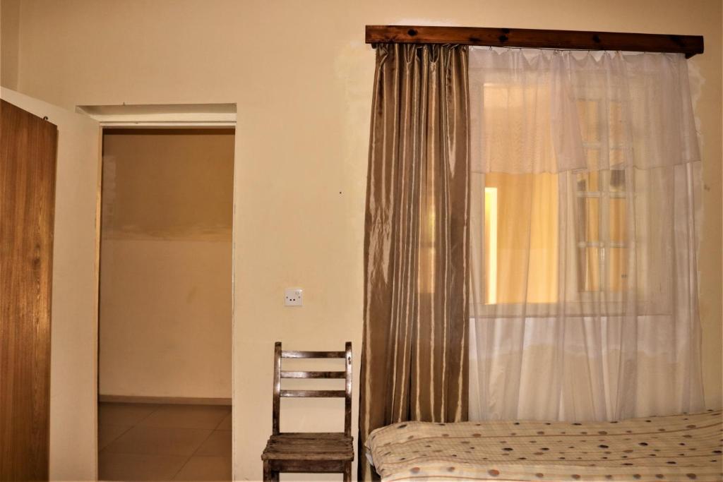 Postel nebo postele na pokoji v ubytování Taoskari Hotel