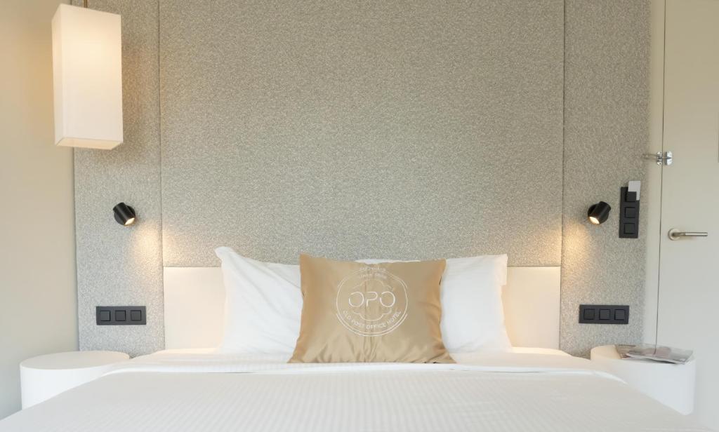 Postel nebo postele na pokoji v ubytování OPO Hotel