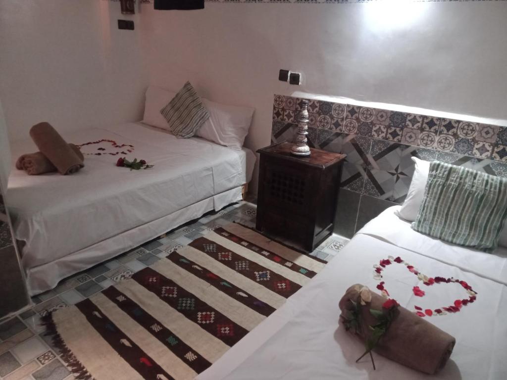 Postel nebo postele na pokoji v ubytování Riad Wink