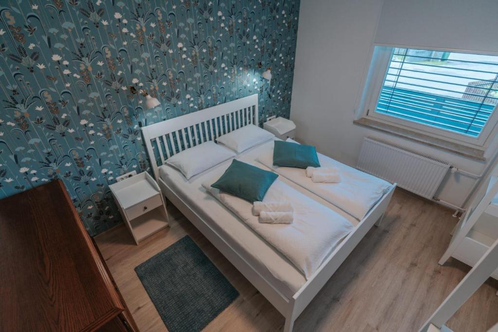 Postel nebo postele na pokoji v ubytování APARTMA LAMBERGER