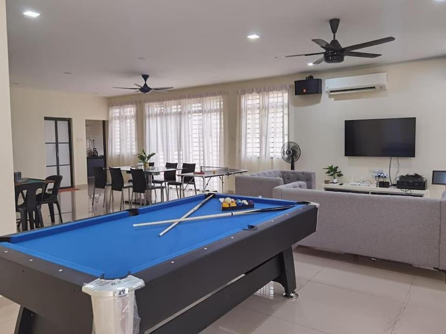 a living room with a pool table in it at Mount Austin Corner Karaoke 24 pax with pool table in Johor Bahru