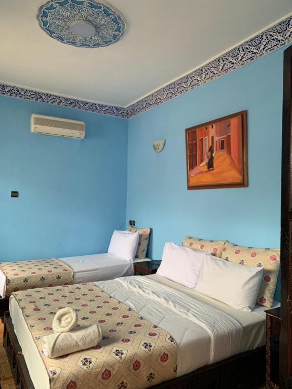 En eller flere senger på et rom på Riad Zahraa Al Ismailia