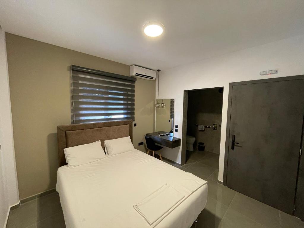Ένα ή περισσότερα κρεβάτια σε δωμάτιο στο Pansion Aphodite