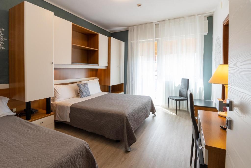 Postel nebo postele na pokoji v ubytování Hotel Crystal