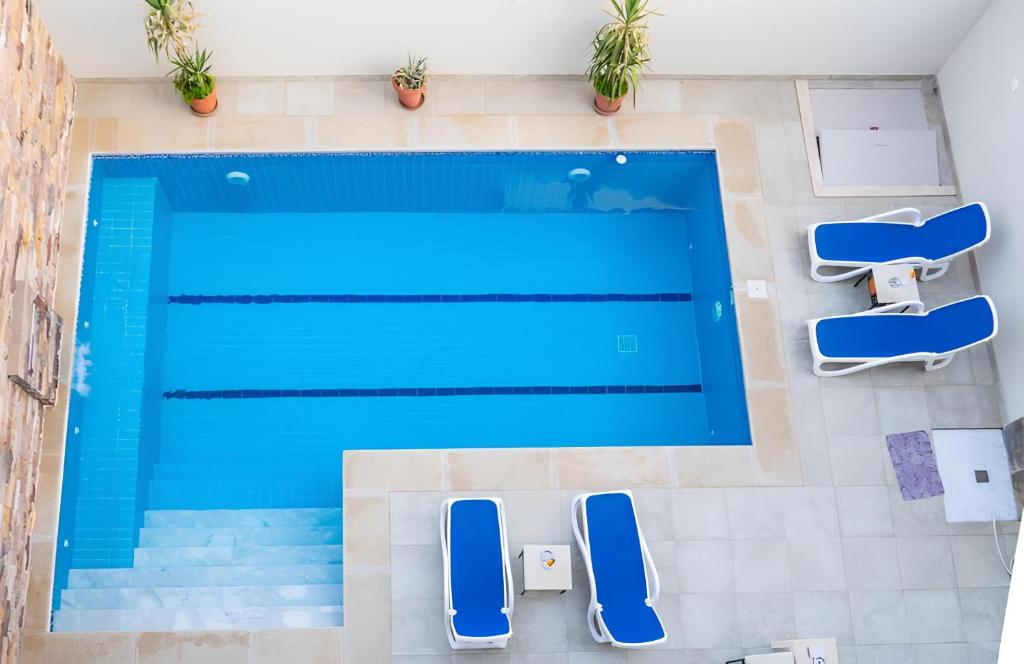 an overhead view of a swimming pool in a house at Royal Home Luxor Nile View in Luxor