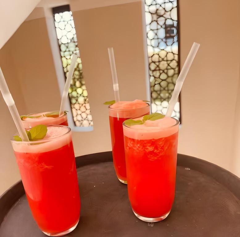 a group of three drinks sitting on a table at Royal Home Luxor Nile View in Luxor