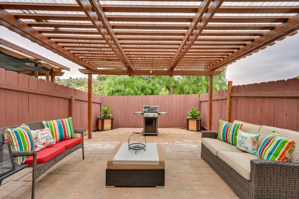 a patio with two couches and a table and a grill at Inviting Poway Studio with Patio and Gas Grill! in Poway