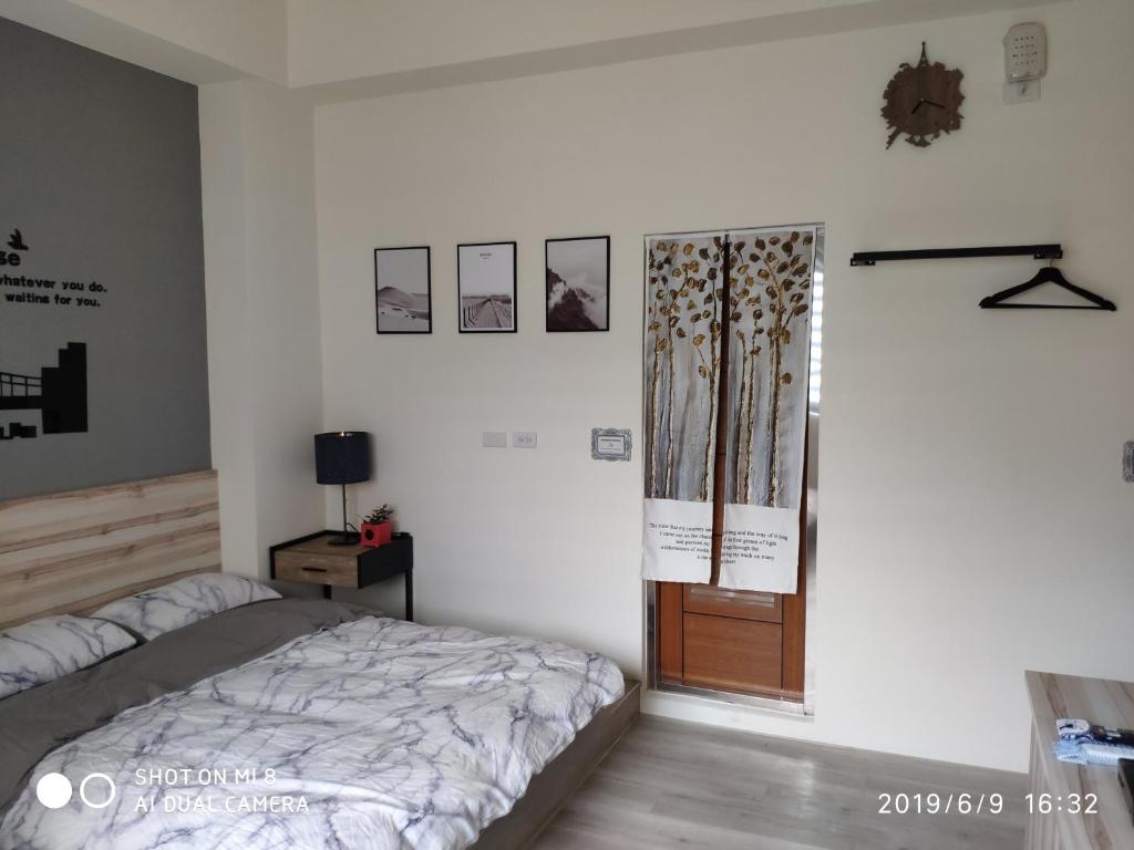Postel nebo postele na pokoji v ubytování WT BnB Taichung