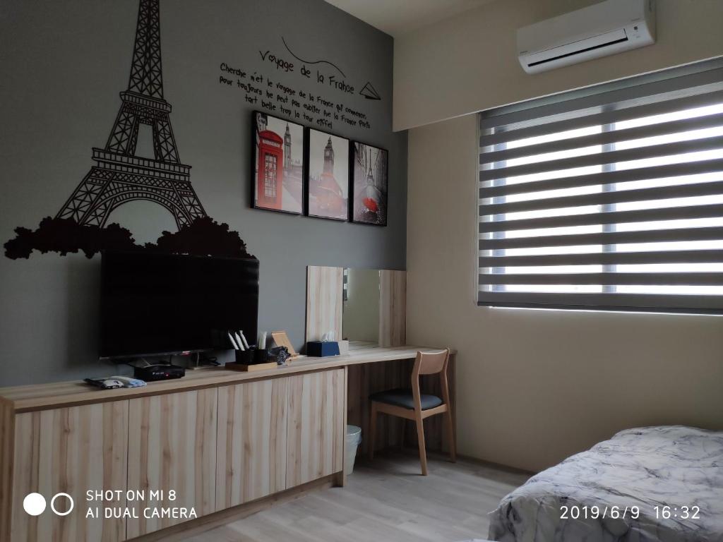 Postel nebo postele na pokoji v ubytování WT BnB Taichung