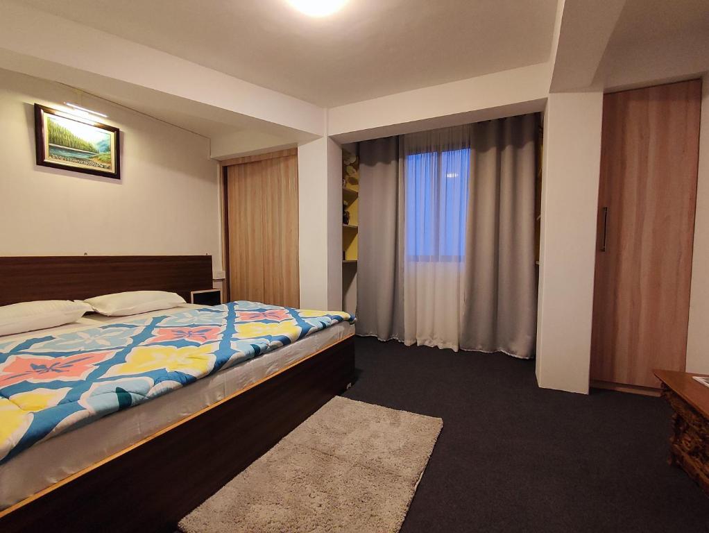 Postel nebo postele na pokoji v ubytování Haven Eleven Homestay