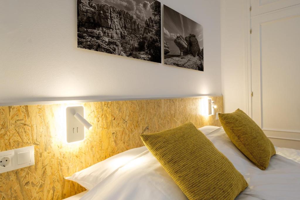 Łóżko lub łóżka w pokoju w obiekcie LOFT2STAY.COM