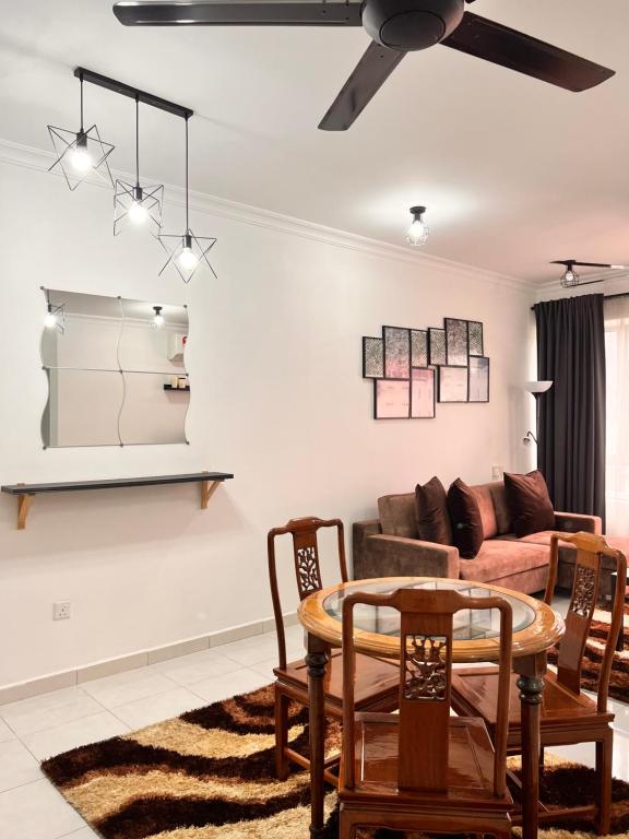 a living room with a couch and a table at Ariesya Homestay 2 in Ipoh