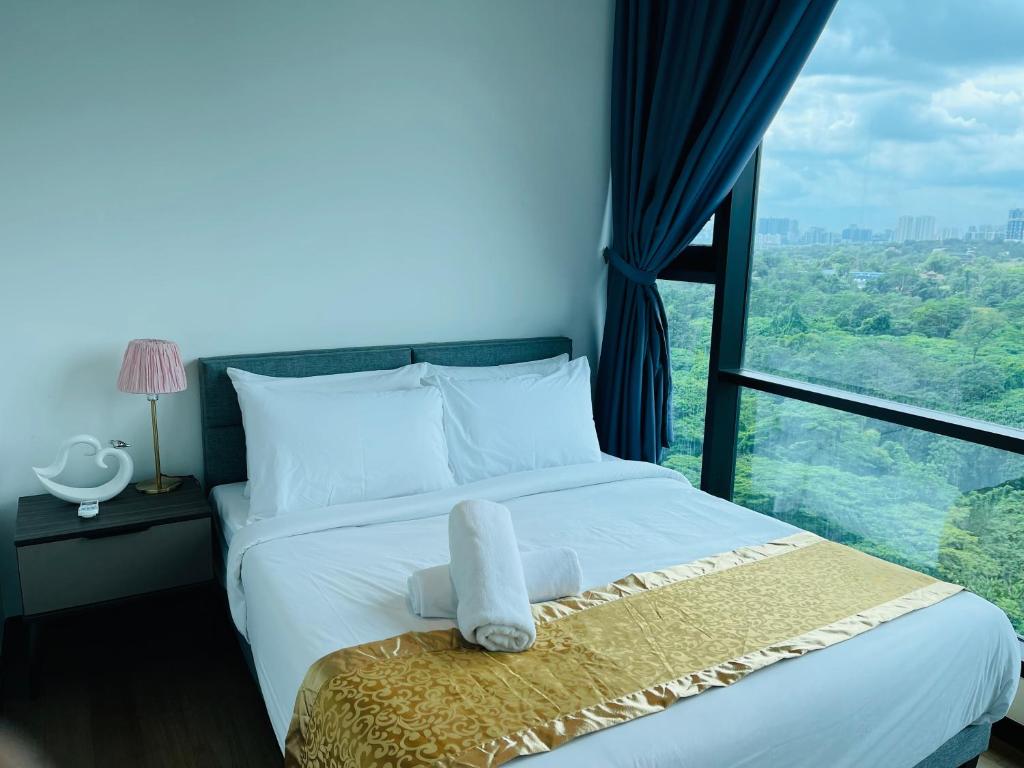 a bed in a room with a large window at ASTRA at Opus Residences Kuala Lumpur in Kuala Lumpur